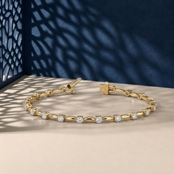 Luminous marquis link lab-grown diamond bracelet shown in a yellow-toned metal on a textured neutral surface.