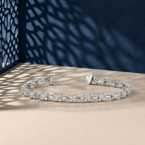 Flora design lab-grown diamond tennis bracelet shown on a split blue and cream background.