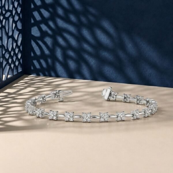 Flora design lab-grown diamond tennis bracelet shown on a split blue and cream background.