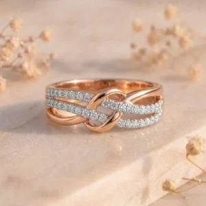 Triple Pavé Infinity Knot Rose Gold Band Ring featuring intricate infinity knot detailing adorned with triple pavé-set lab-grown diamonds in a luxurious rose gold finish.