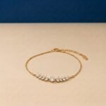 Marquise lab diamond leaf bracelet in yellow gold with laurel branch design.