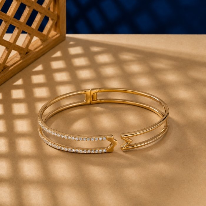 Arrow-Lab-Diamond-Hinged-Cuff-Bangle Yellow gold arrow cuff bangle with two rows of lab diamonds and a hinged opening.