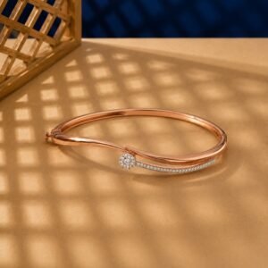 Rose gold bypass bangle with a lab diamond cluster and pavé-set diamond trail.
