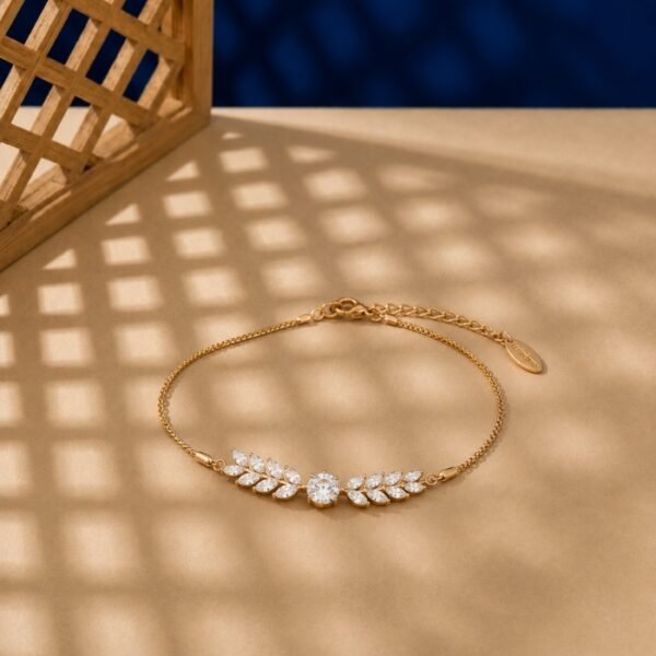 Marquise lab diamond leaf bracelet in yellow gold with laurel branch design.