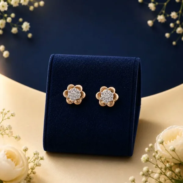 Pair of 18K yellow gold double nested tear-drop drop earrings featuring brilliant pave lab-grown diamonds, displayed on a blue velvet mount.
