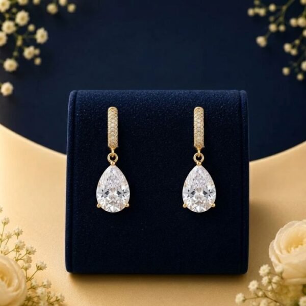 Pear cut solitaire lab diamond drop earrings in yellow gold with sparkling diamonds
