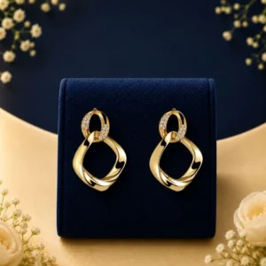 Celestial Link lab grown diamond earrings in gold with modern open drop design on navy luxury display