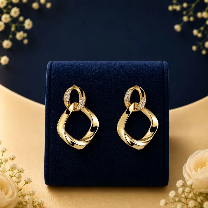 Celestial Link Lab Grown Diamond Earrings Celestial Link lab grown diamond earrings in gold with modern open drop design on navy luxury display