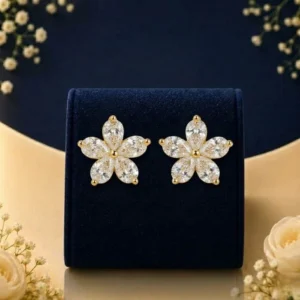 Lab grown diamond flower earrings with white diamond petals on navy velvet jewellery display
