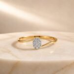 Oval pavé lab diamond open ring in yellow gold with sparkling oval diamond centerpiece