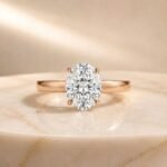 Oval solitaire lab diamond engagement ring in rose gold with a brilliant oval-cut center diamond
