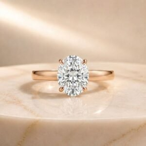 Oval solitaire lab diamond engagement ring in rose gold with a brilliant oval-cut center diamond