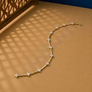 Floral Lab Diamond Link Bracelet featuring diamond clover clusters and gold bar links on a warm studio background.