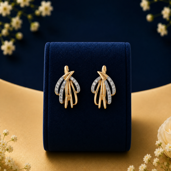 Gold multi-layer earrings with lab grown diamonds on a blue velvet box