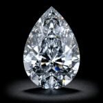 Brilliant pear cut lab grown diamond with elegant teardrop shape and exceptional sparkle on white background
