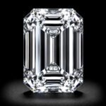 Elegant emerald cut lab grown diamond with step-cut facets and exceptional clarity on white background
