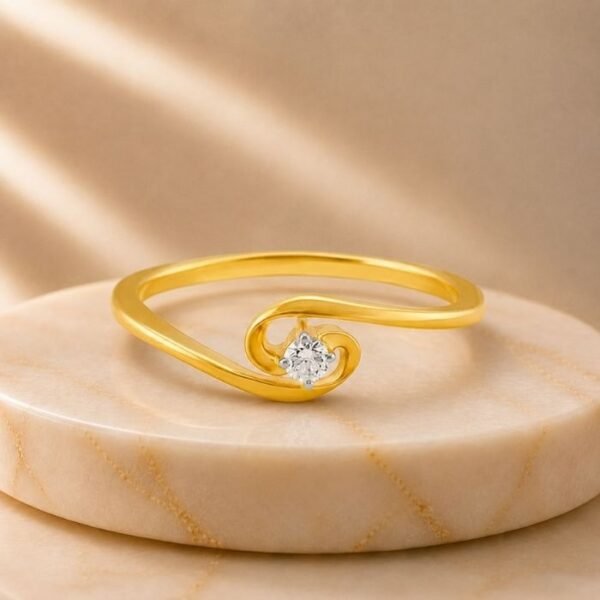 Enchanted Loop Lab Grown Diamond Ring with elegant swirl design and brilliant round lab grown diamond in yellow gold finish.