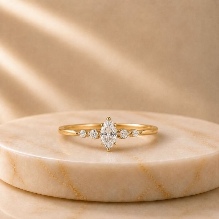 Seraphina Marquise Lab Grown Diamond Ring Seraphina Marquise Lab Grown Diamond Ring showing front view, side view, top view and angled perspective with brilliant marquise cut diamond.