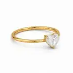 Heart shaped solitaire diamond ring in yellow gold side angle on white background