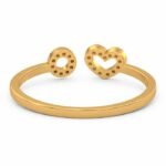 Back view of adjustable gold ring with heart and circle design