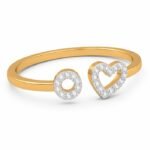 Gold adjustable open ring with diamond heart and circle charms, angled view