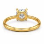 Back view of round solitaire yellow gold diamond ring showing stone setting