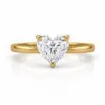 Heart Shaped Solitaire Gold Ring with Brilliant Cut Diamond on White Background