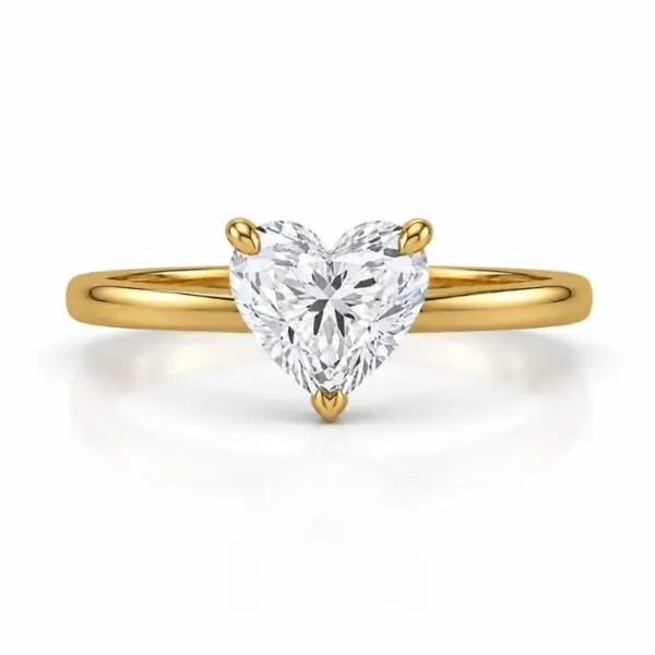 Heart Shaped Solitaire Gold Ring with Brilliant Cut Diamond on White Background