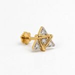 Three-quarter view of Trinity Spark Lab Grown Diamond Nose Pin showing four round diamonds, yellow gold triangular accents, and screw-back post.