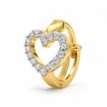 Angled view of Love Spark Lab Grown Diamond Nose Ring showing its diamond-studded heart and yellow gold hoop.