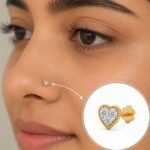 Heart shape lab grown diamond nose pin in yellow gold worn by woman