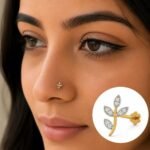 Elegant gold and diamond floral jewellery pendant with leaf-shaped design on white background