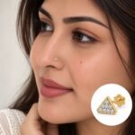 Woman wearing triangle cluster lab grown diamond nose pin in yellow gold