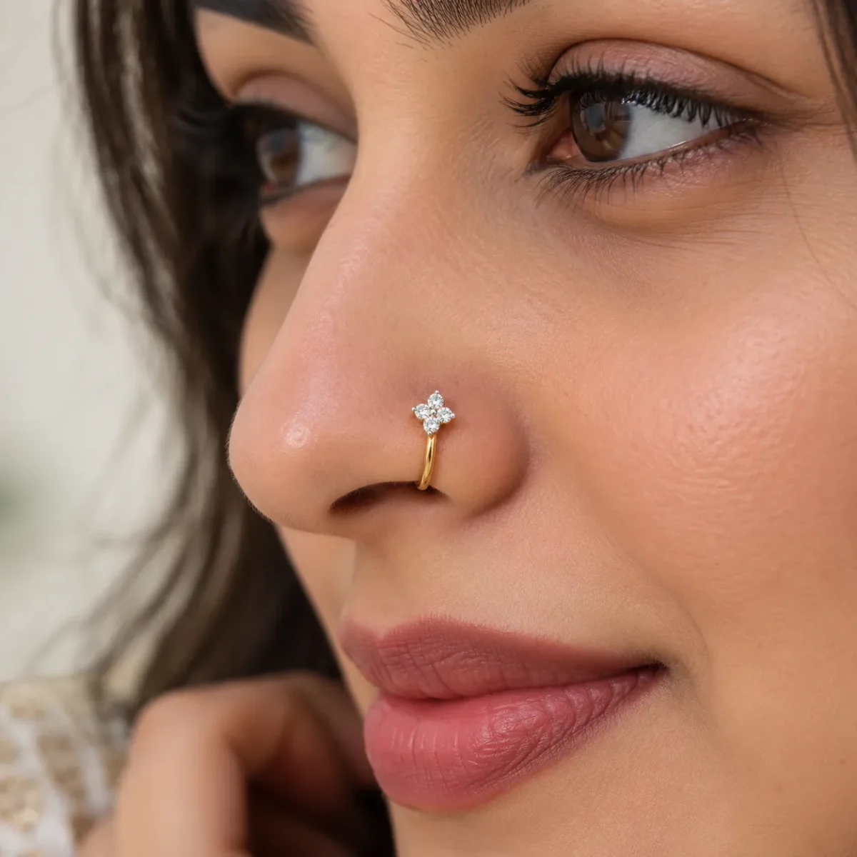 Four Petal Floral Lab Grown Diamond Nose Ring worn by woman in yellow gold