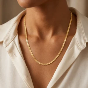 Man wearing a premium 18K yellow gold chain with a classic flat interlinked design