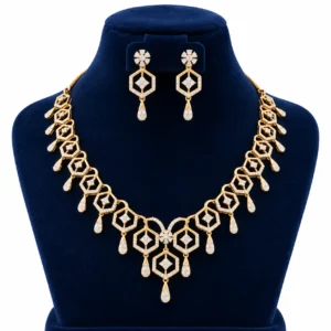 18K gold geometric hexagon lab grown diamond necklace set with sparkling hexagonal motifs, dangling teardrop accents and matching earrings on navy blue jewellery bust