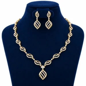 18K Gold Leaf Design Lab Grown Diamond Necklace Set with Matching Earrings featuring sparkling diamond-studded leaf motifs, floral centre and elegant drop pendant displayed on a navy blue jewellery stand.