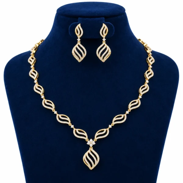 18K Gold Leaf Design Lab Grown Diamond Necklace Set with Matching Earrings featuring sparkling diamond-studded leaf motifs, floral centre and elegant drop pendant displayed on a navy blue jewellery stand.