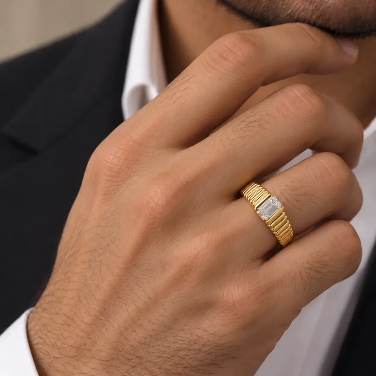 Bold Heritage Lab Grown Diamond Gold Ring worn by a male model, featuring an emerald cut solitaire diamond and ribbed yellow gold band.
