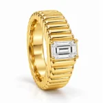 Bold Heritage Lab Grown Diamond Gold Ring in standing angle view with emerald cut solitaire diamond and textured yellow gold band.