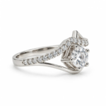 Side angle of Diamond Dew Moissanite Silver Ring featuring a round centre stone and sparkling Moissanite side stones.