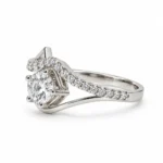 Angled view of Diamond Dew Moissanite 925 Sterling Silver Ring showing its prong-set centre stone and curved silver band.