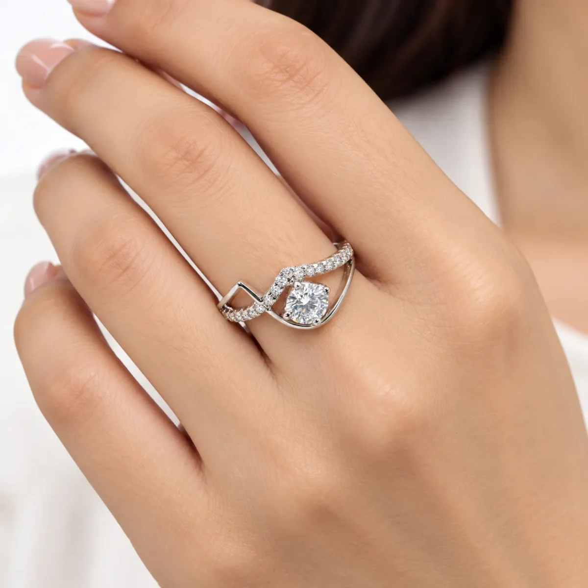 Diamond Dew Moissanite 925 Sterling Silver Ring worn on a female model's finger.
