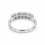 Back view of Five Wishes Moissanite Diamond Ring showing polished silver-tone band and open-back settings beneath five round Moissanite stones.