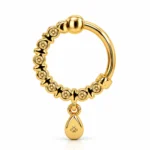 Back view of Luna Drop Lab Grown Diamond Nose Ring featuring yellow gold hoop, diamond settings and dangling teardrop charm.