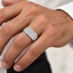 Royal Matrix Moissanite Diamond Men's Ring in 925 Sterling Silver worn on a male model's finger, featuring three rows of brilliant round-cut Moissanite stones.