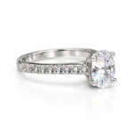 Right side view of Olivia oval solitaire moissanite diamond ring with sparkling pavé stones in 925 sterling silver.