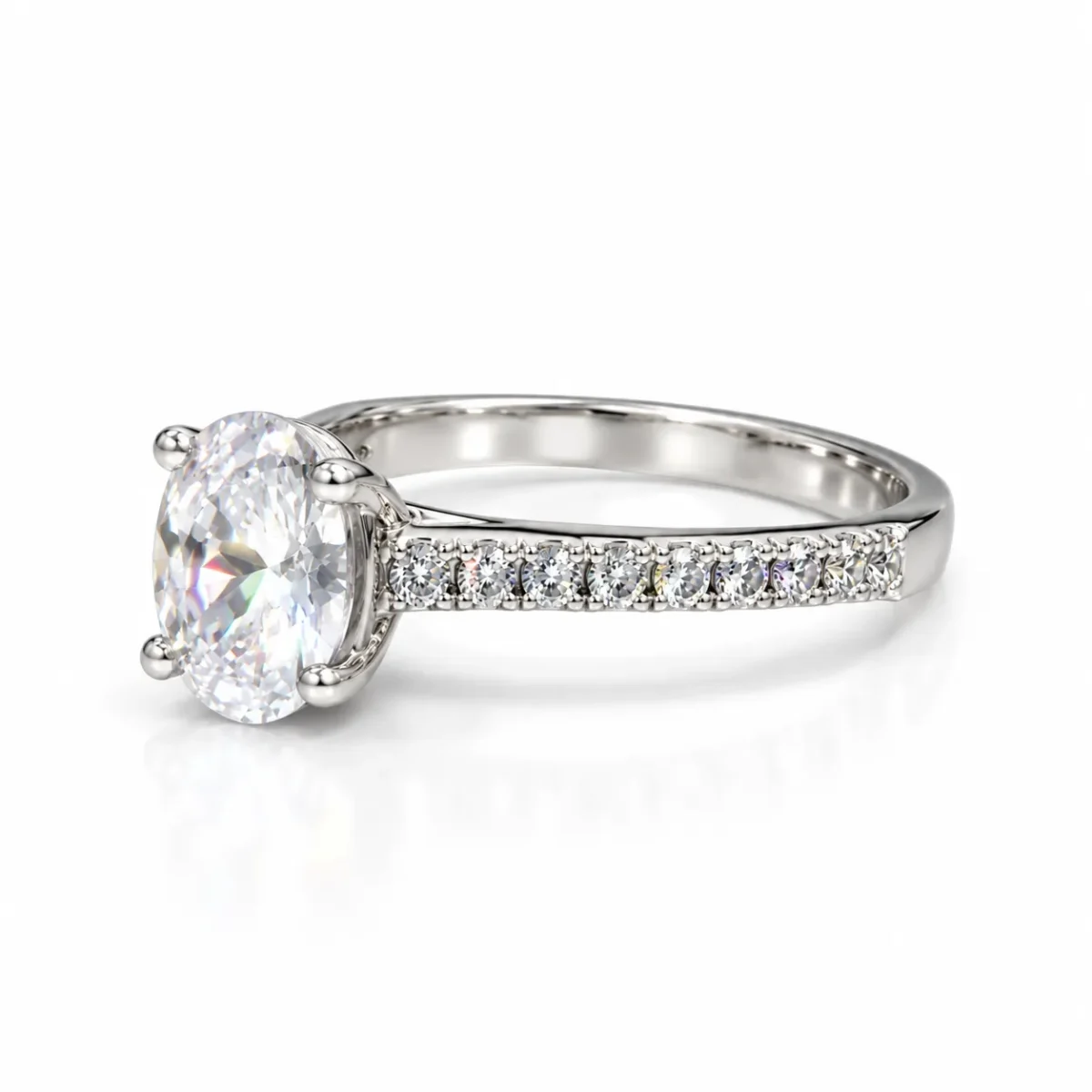 Left side view of Olivia oval moissanite diamond ring featuring a four-prong setting and pavé 925 silver band.
