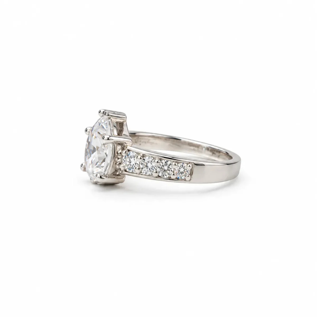 Pear Cut Moissanite Diamond Ring in 925 Sterling Silver featuring sparkling round side stones and an elegant side-angle design.