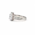 Pear Cut Moissanite Diamond Ring in 925 Sterling Silver featuring sparkling round side stones and an elegant side-angle design.